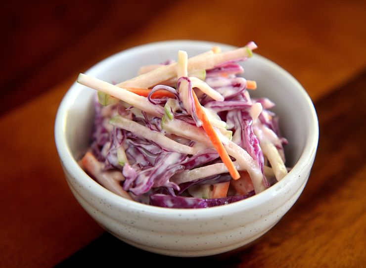 Most of the calories in coleslaw is in the dressing or mayonnaise, so using a light variety is healthy