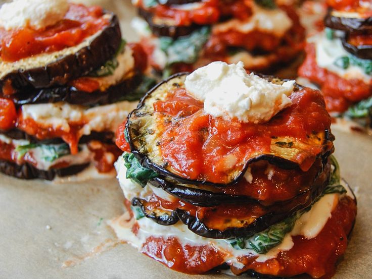 Eggplant pairs well with tomatoes and herbs in many grilled and baked dishes like this eggplant stack