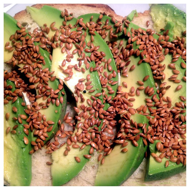 A wonderful breakfast - Avocado Toast with Toasted Flaxseeds - delicious and highly nutritious 