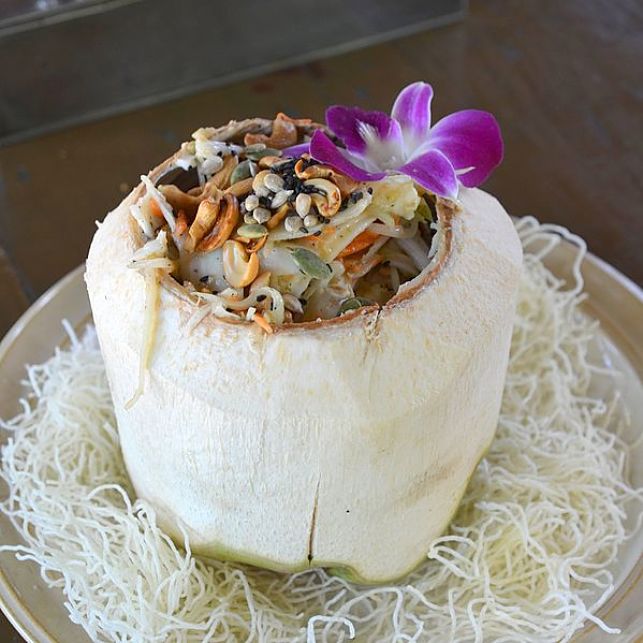 Delightful dish served in a whole coconut with shell removed